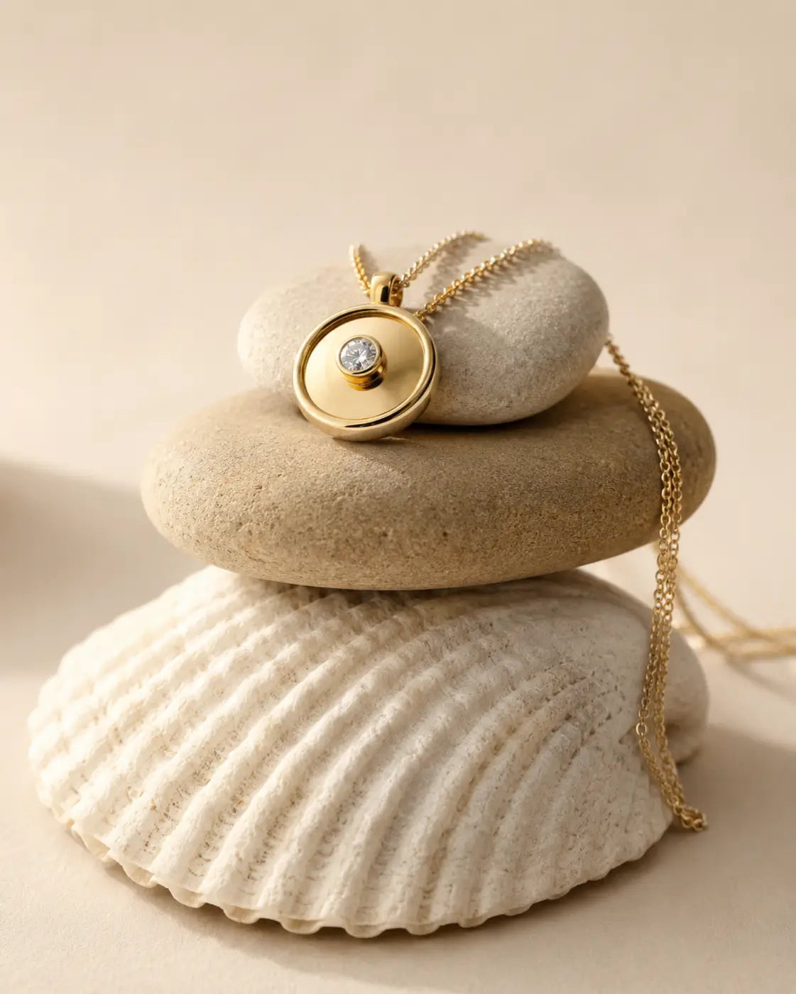 Engraved 14ct gold yellow circular pendant necklace designed with a central 3mm lab diamond resting on stones