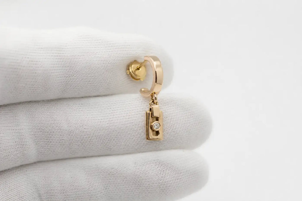 Gold-tone miler axis drop earrings with solid 14ct yellow gold rectangular pendant and 2mm diamond center