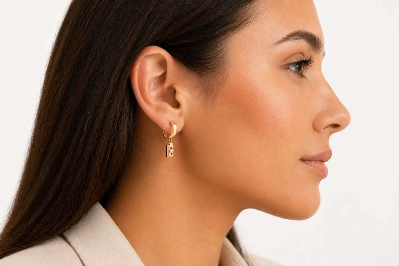 Solid 14ct yellow gold miler axis drop earrings featuring gold-toned hoops with small rectangular engraved pendants