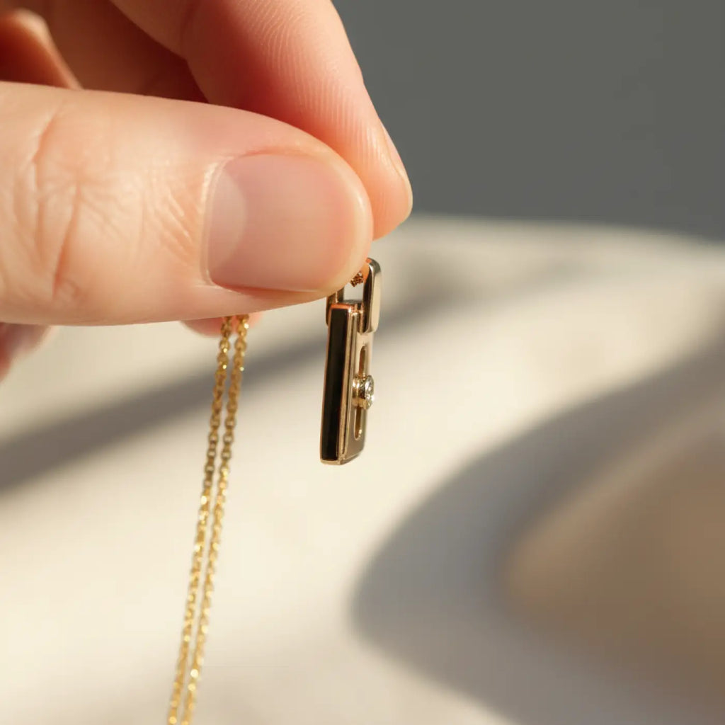 14k gold diamond pendant necklace with lock-shaped black inlay