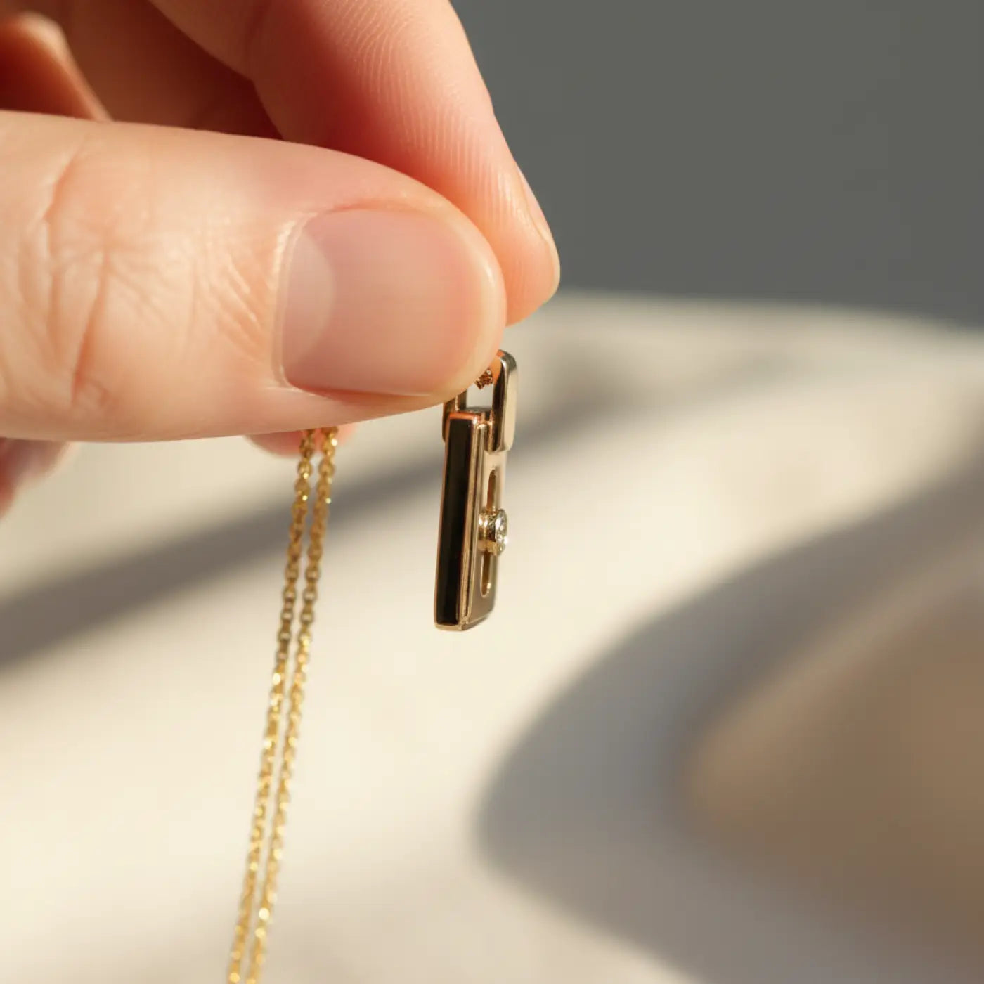 14k gold diamond pendant necklace with lock-shaped black inlay