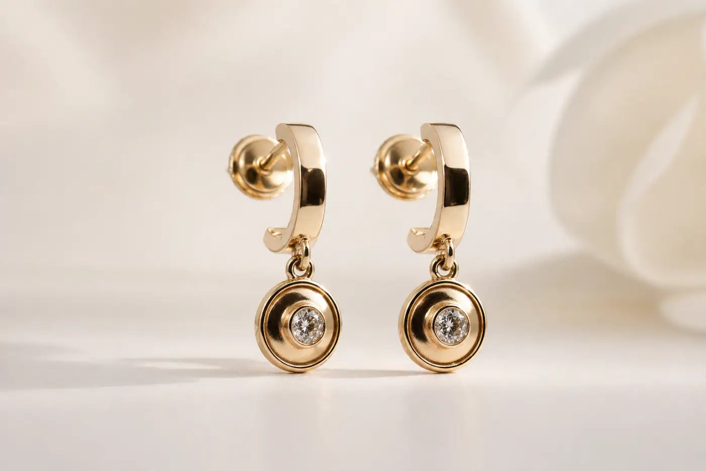 Polished gold diamond drop earrings with solid 14ct yellow gold hoops and a central sparkling diamond setting