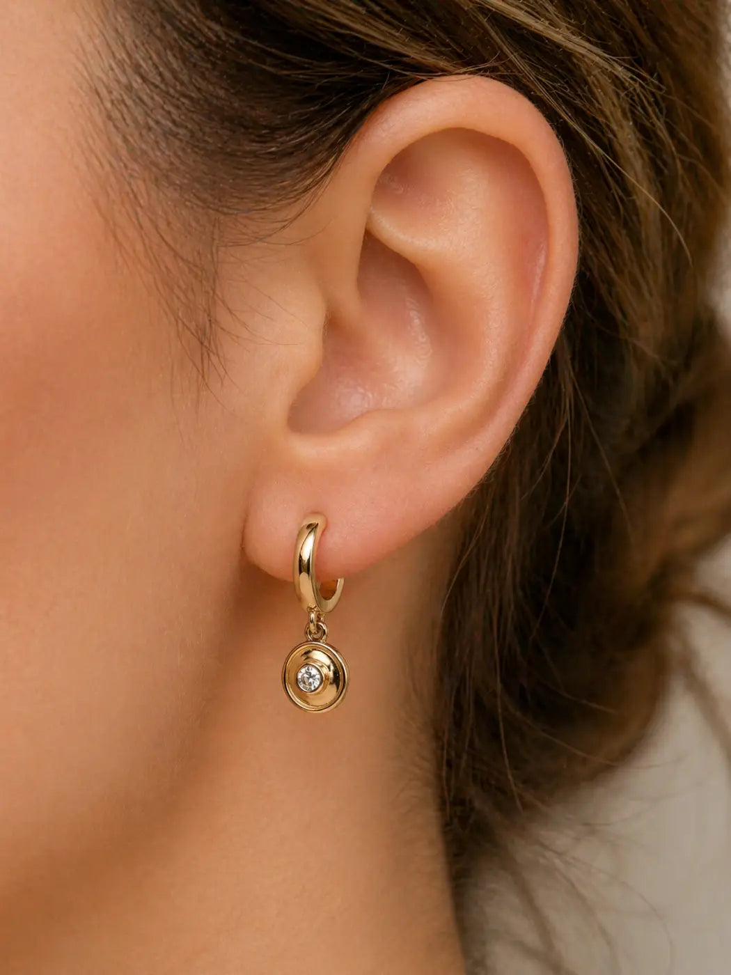 Polished gold diamond drop earrings featuring solid 14ct yellow gold hoops with a clear gemstone pendant