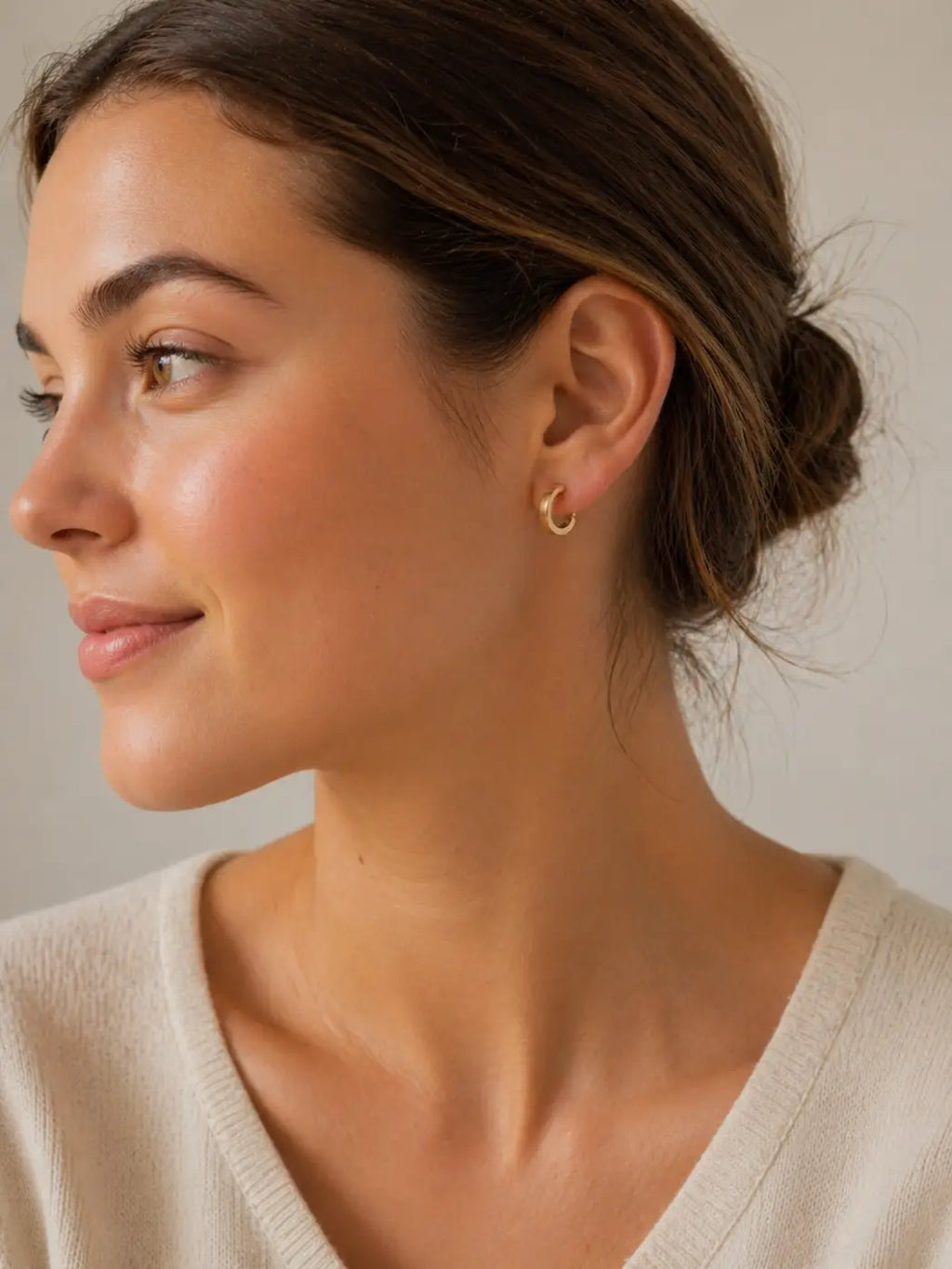 Delicate yellow gold polished gold hoops with a sleek minimalist design and secure smartlock fastening