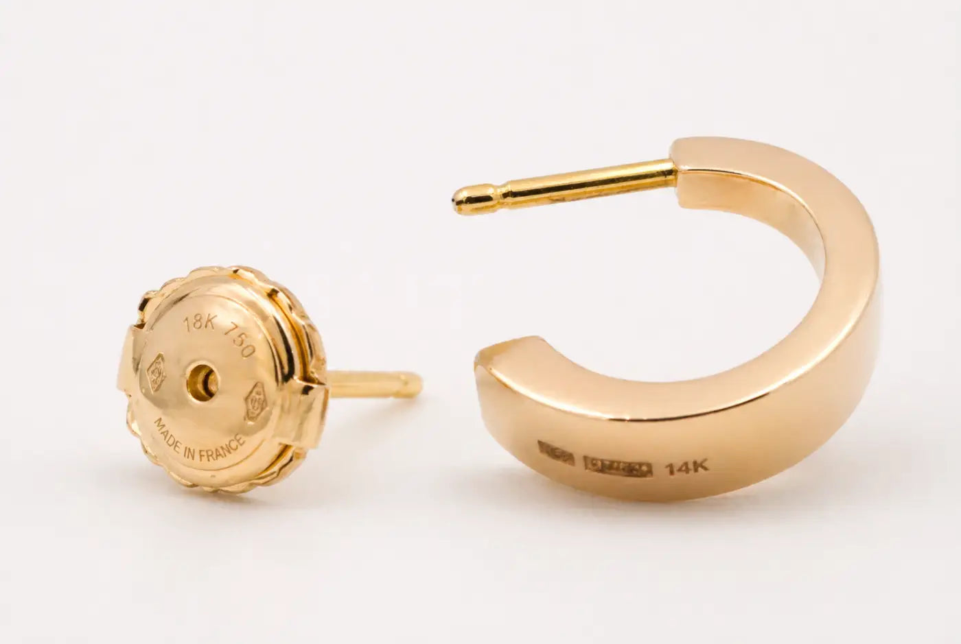 Polished yellow gold hoops with smartlock fastening showing engraved 18k 750 made in france and 14k stamps