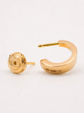 Polished yellow gold hoops in 14k with smartlock fastening and engraved markings showing material and origin